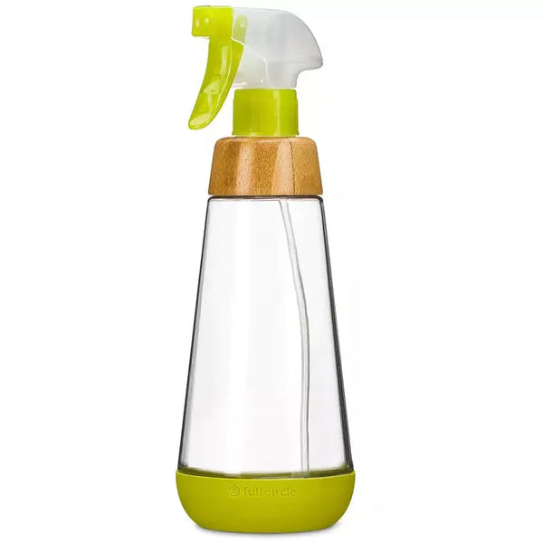 clear glass spray bottle with a green & clear plastic nozzle, bamboo collar, and green silicone bottom. white background clear glass spray bottle with a green & clear plastic nozzle, bamboo collar, and green silicone bottom. white background