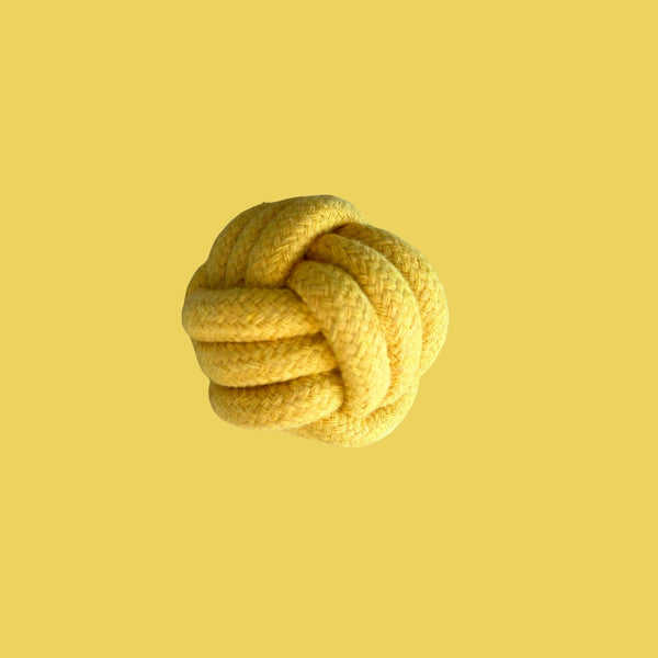 Yellow rope knot on a yellow background
