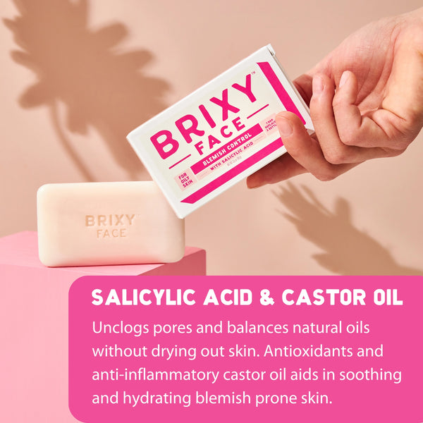 Brixy Face soap bar and packaging on a pink background with text about salicylic acid and castor oil.