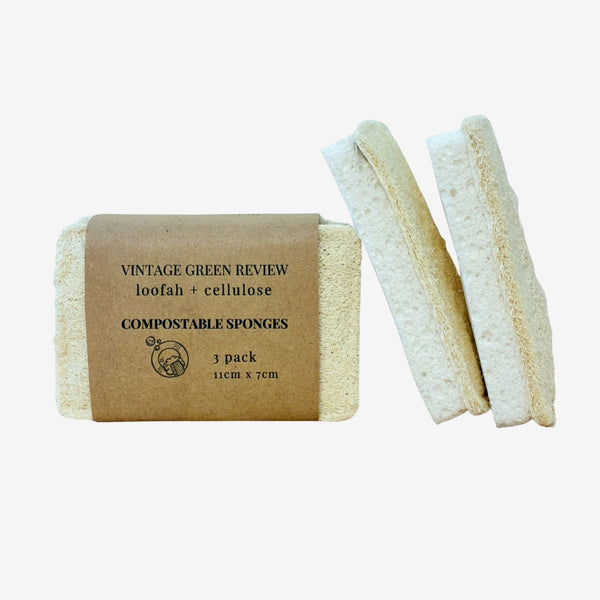 Pack of compostable sponges with a cardboard packaging label on a white background