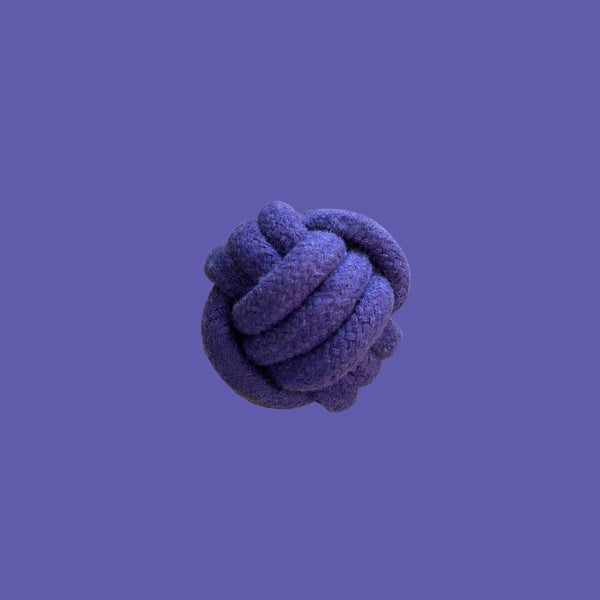 Purple rope knot ball on purple background